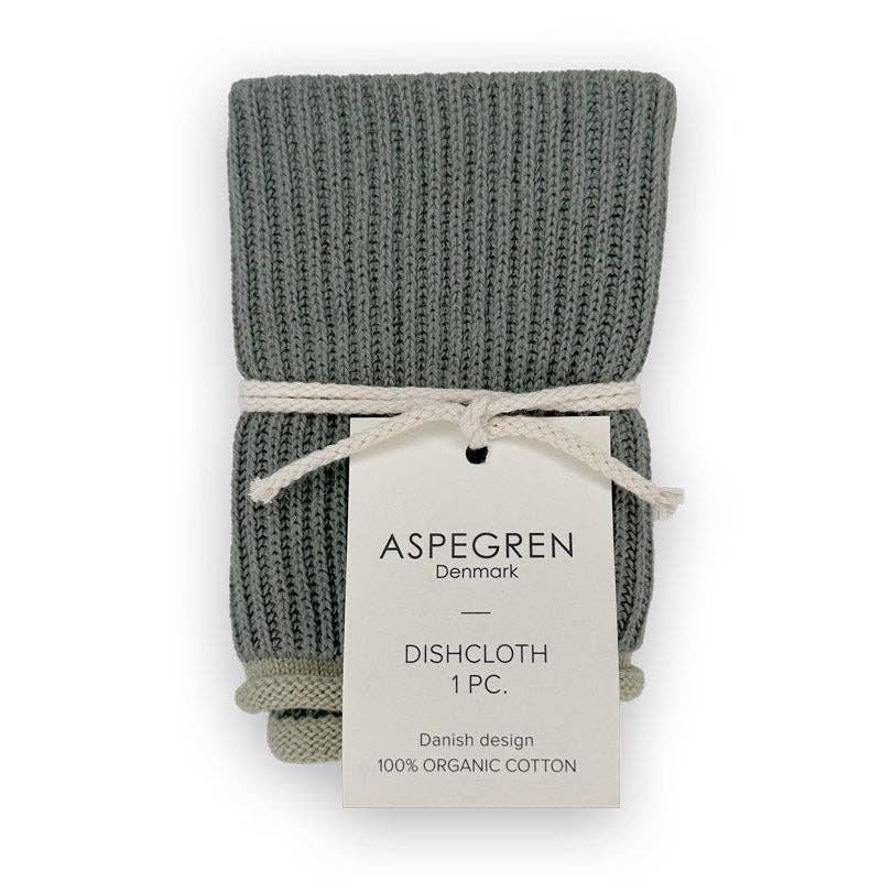 Ein 3er-Set gefalteter grauer Strick-Küchentücher von Aspegren Denmark, mit einer cremefarbenen Schnur zusammengebunden und mit einem Etikett versehen, auf dem steht: Aspegren Denmark | Grünes Küchentuch 3er-Geschenkset, dänisches Design, 100 % Bio-Baumwolle.