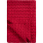 Eine gefaltete rote Ib Laursen | Quilt Decke rot mit Kreuzstich von IB Laursen, mit abgestepptem Gittermuster und umgedrehter Ecke, ideal als gemütliche skandinavische Wohndecke für stilvolle Wohnräume.