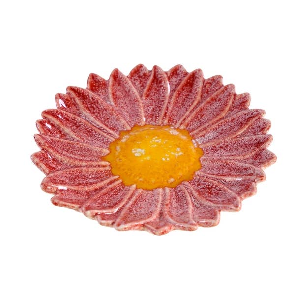 Die „Werner Voß Pinke Schale in Blumenform aus Steingut“ ist ein blumenförmiger Keramikteller mit rosa, strukturierten Blütenblättern und einer detailreichen Mitte, der an eine zarte Blüte erinnert.