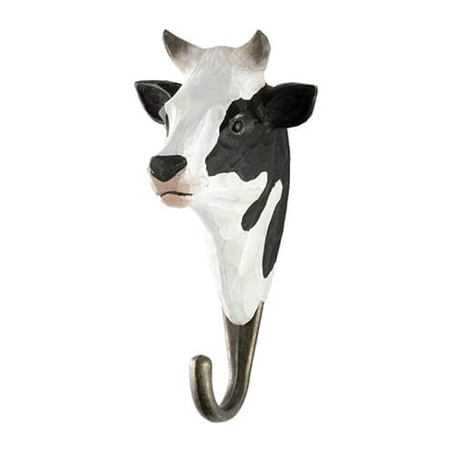 Der Wildlife Garden Handgeschnitzter Wandhaken aus Holz 'Kuh' von Wildlife Garden ist ein dekorativer, schwarz-weiß bemalter Kuhkopf mit bronzefarbenem Metallhaken-ein originelles Geschenk für jedes Zuhause.