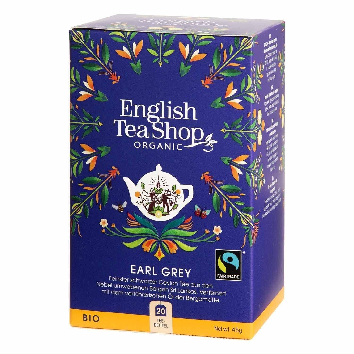 Eine blaue Schachtel von English Tea Shop ETS | Earl Grey BIO Fairtrade mit 20 Teebeuteln ist mit Blumenmotiven und einer Teekannen-Illustration verziert und trägt sowohl das Fairtrade- als auch das Bio-Siegel. Die Packung enthält 20 Teebeutel.