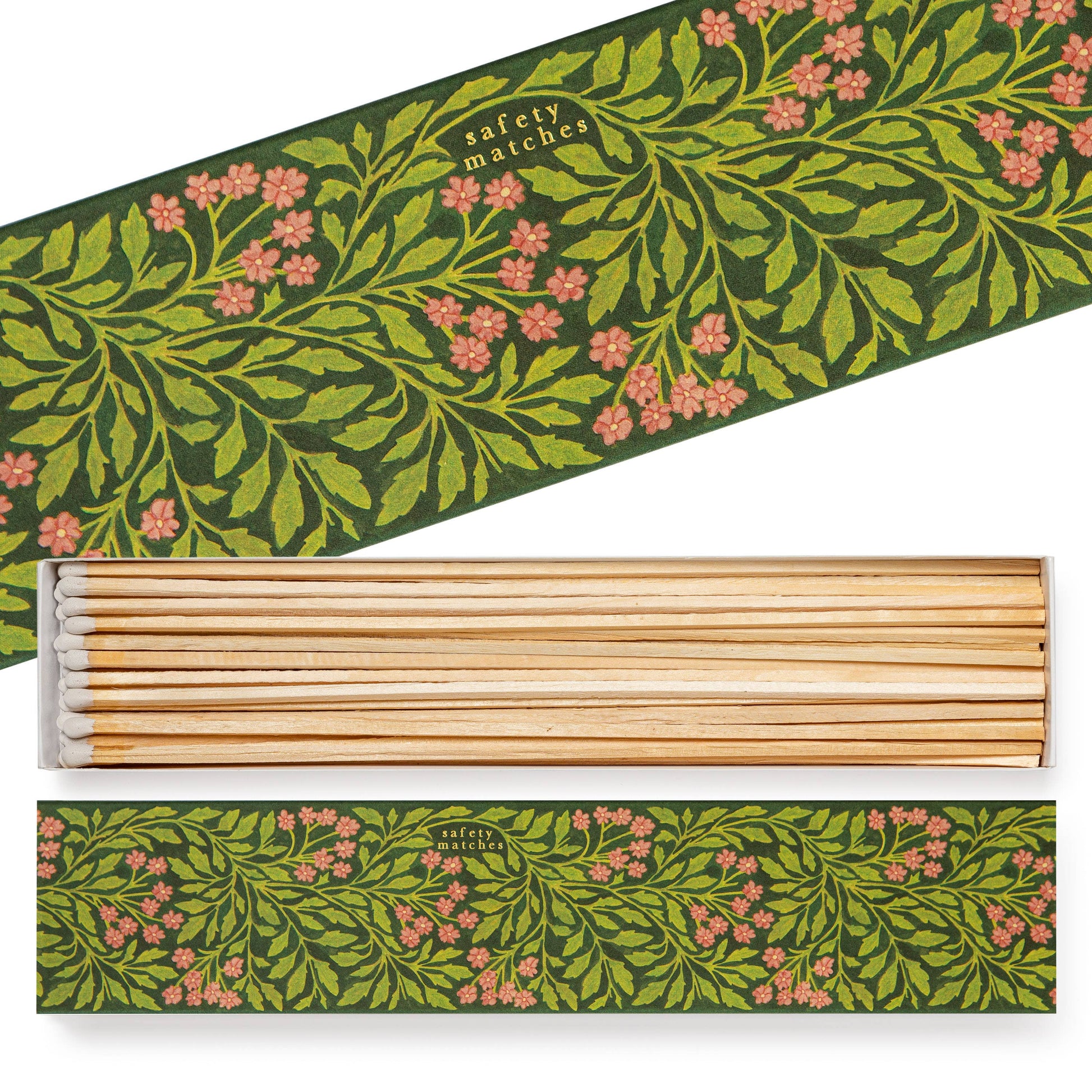 Die geöffnete Archivist Gallery 'Grüne Flora' Lange Streichhölzer Schachtel hat ein rechteckiges Design mit grünem und rosa Blumenmuster, in dem extralange Sicherheitsstreichhölzer mit weißen Spitzen ordentlich angeordnet sind.