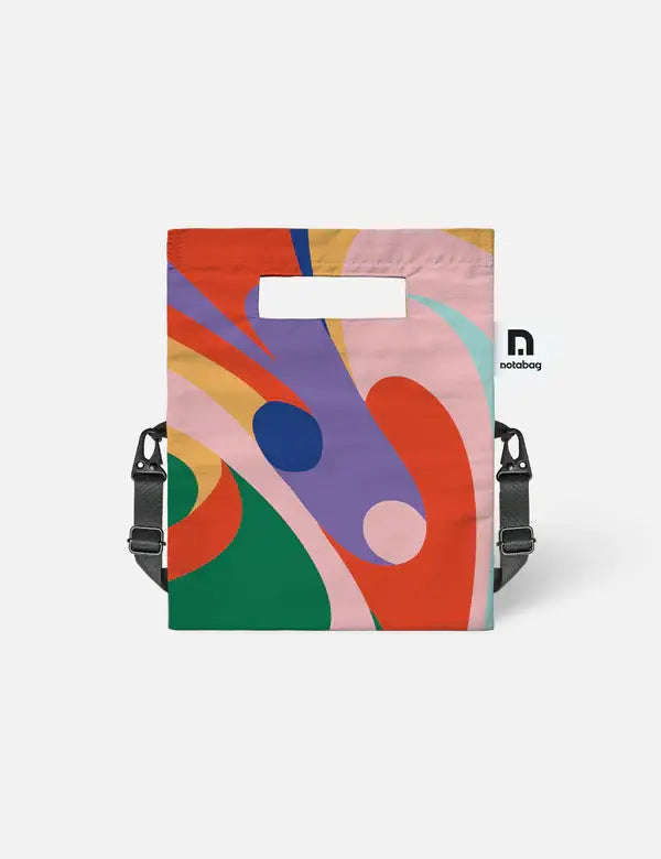 Die Notabag | 'Flow' Leichte Umhängetasche von Notabag ist eine kompakte Umhängetasche mit abstrakten Wirbelmustern in leuchtenden Farben, rechteckigem Cutout-Griff, verstellbarem Gurt und einem kleinen "notabag" Label.