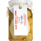 Ein Glas mit Don Antonio | Grüne Oliven mit Zitrone aus den Abruzzen 280 g, in Flüssigkeit, mit weißem Papierdeckel und Schnur. Das italienische Etikett lautet Olive Verdi al Limone; ideal für Antipasti, mit einer Notiz angebracht.