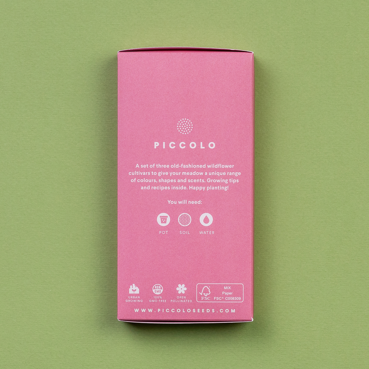 Eine rosafarbene rechteckige Packung von Piccolo Seeds (Alte Blumenwiese, Deluxe-Kollektion) mit weißem Text und grünen Symbolen für Topf, Erde, Wasser. Beschriftete Wildblumensamen mit Pflanzanleitung - Gentechnikfrei.