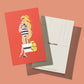 Eine Postkarte mit einer von I AM ITALIANO inspirierten Illustration | 'Venere' Bio Zartbitterschokolade mit Mandel, perfekt für Fans von I AM ITALIANO. Die Rückseite ist bis auf den ITALIANO-Schriftzug und die Adresszeilen leer.
