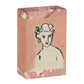 Die Handseife 'Cherry Blossom' (150 g) von Archivist Gallery kommt in einer rosa marmorierten Verpackung mit einem goldenen Wellenrand und einer schwarzen Strichzeichnung eines Frauengesichts auf der Vorderseite.