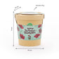 Ein brauner Papierbehälter der TDJ Stadtgärtner GmbH mit der Aufschrift „Deine Schokoblümchen“ ist 11 cm hoch, hat einen Durchmesser von 10 cm und wiegt 60 g. Das blumige Etikett ist mit roten Blumen und grünen Akzenten verziert. Dieses Anzuchtset | Schokoblumen aus dem Becher eignet sich perfekt als Geschenkidee für Pflanzenliebhaber oder als Starter-Set, um eigene schokoladenduftende Blumen zu züchten.