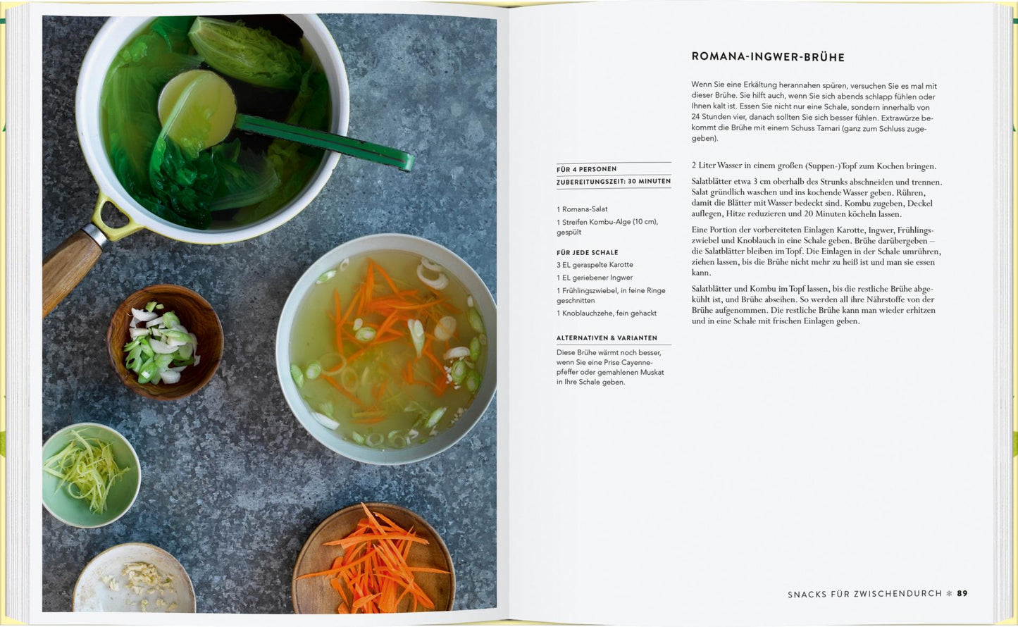 Im offenen Kochbuch "Vergnügt Vegan" vom Gerstenberg Verlag finden sich Rezepte wie Romana-Ingwer-Brühe, abgebildet mit klarer Brühe, Pak Choi, Karottenstreifen und Kräutern - perfekt für alle, die neue vegane Rezepte entdecken wollen.