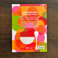 Die Rückseite des DK Kochbuch Ottolenghi "Comfort" zeigt lebendige, sich überlappende Kreise, deutschen Text, eine weiße Löffelgrafik und Verlagsangaben. Es zeigt Genuss und natürliche Zutaten auf einem dunklen Holzhintergrund.