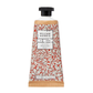 Die 50-ml-Tube der William Morris at Home 'Foliage' Handcreme hat ein rot-weißes Blättermuster, eine schwarze Kappe und ein Etikett mit dem Hinweis, dass sie vegan ist.