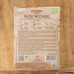Eine Packung Sperli's | Bio Keimsprossen Saatgut 'Milde Mischung' wird auf einer Holzfläche präsentiert. Die Verpackung enthält eine Anbauanleitung, einen QR-Code, Bio-Zertifizierungssymbole und detaillierte Informationen - ideal für den Sprossenanbau zu Hause.