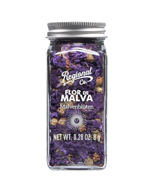 Ein Klarglasgefäß mit silbernem Deckel und der Aufschrift Viani | Essbare Malvenblüten 8 g enthält getrocknete Malvenblüten von Viani. Auf der Vorderseite ist das Nettogewicht von 8 g (0,28 oz) aufgedruckt.