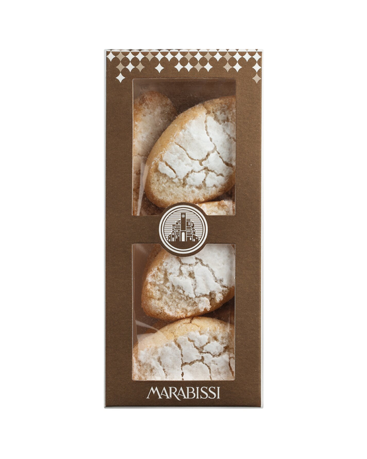 Eine Schachtel Viani „Ricciarelli“ Mandelmakronen aus der Toskana (120 g) mit Sichtfenster zeigt vier runde, mit Puderzucker bestäubte Kekse. Die braune Verpackung ist mit an Siena angelehnten Mustern verziert und trägt unten das Viani-Logo.