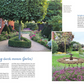 Inspiriert von "Klotzen statt kleckern | Gartengestaltung mit Katrin Iskam" aus dem Kosmos Verlag zeigt dieser malerische Garten gestutzte Sträucher, aufgeräumte Blumenbeete, eine kreisförmige Hecke um einen Baum und einen Springbrunnen in der Nähe von leuchtenden Blüten.