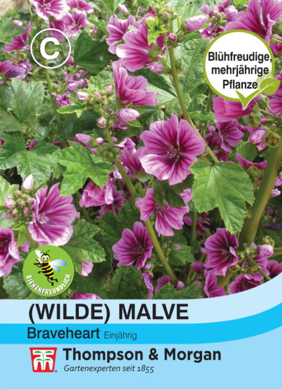 Ein Päckchen Thompson und Morgan Wilde Malve Brave Heart Samen zeigt lila-rosa gestreifte Blüten und grüne Blätter, ideal für den Bauerngarten. Die deutsche Verpackung ist mit bienenfreundlichen und lang blühenden Etiketten sowie Logos versehen.