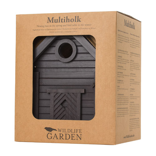 Eine braune Pappschachtel mit Klarsichtfenster zeigt den Nistkasten & Futterhaus in einem stilvollen Design | Carbon Black von Wildlife Garden. Auf den Seiten des Kartons sind der Markenname und die Produktangaben zu finden.