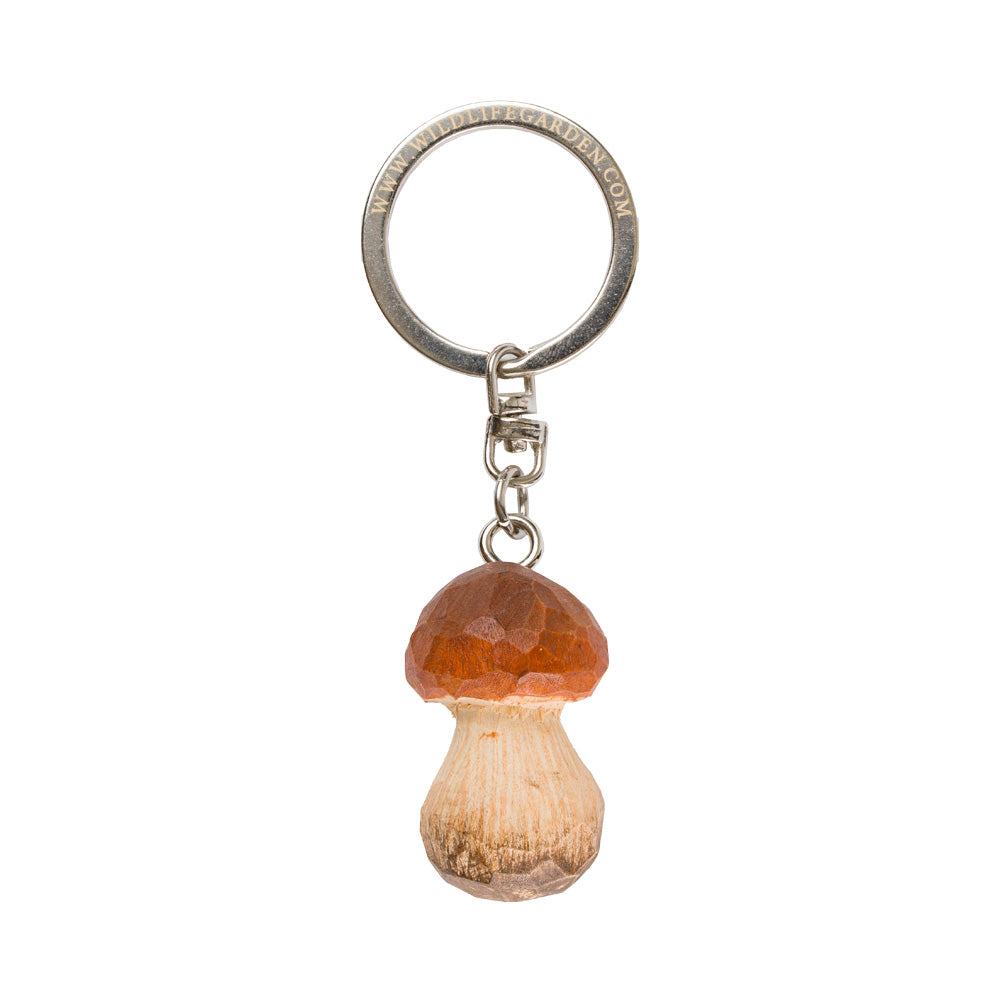 Der handgefertigte Schlüsselanhänger aus Holz "Steinpilz" von Wildlife Garden zeigt einen realistischen Pilz mit braunem Hut und beigem Stiel - das perfekte Geschenk für Naturfreunde!.