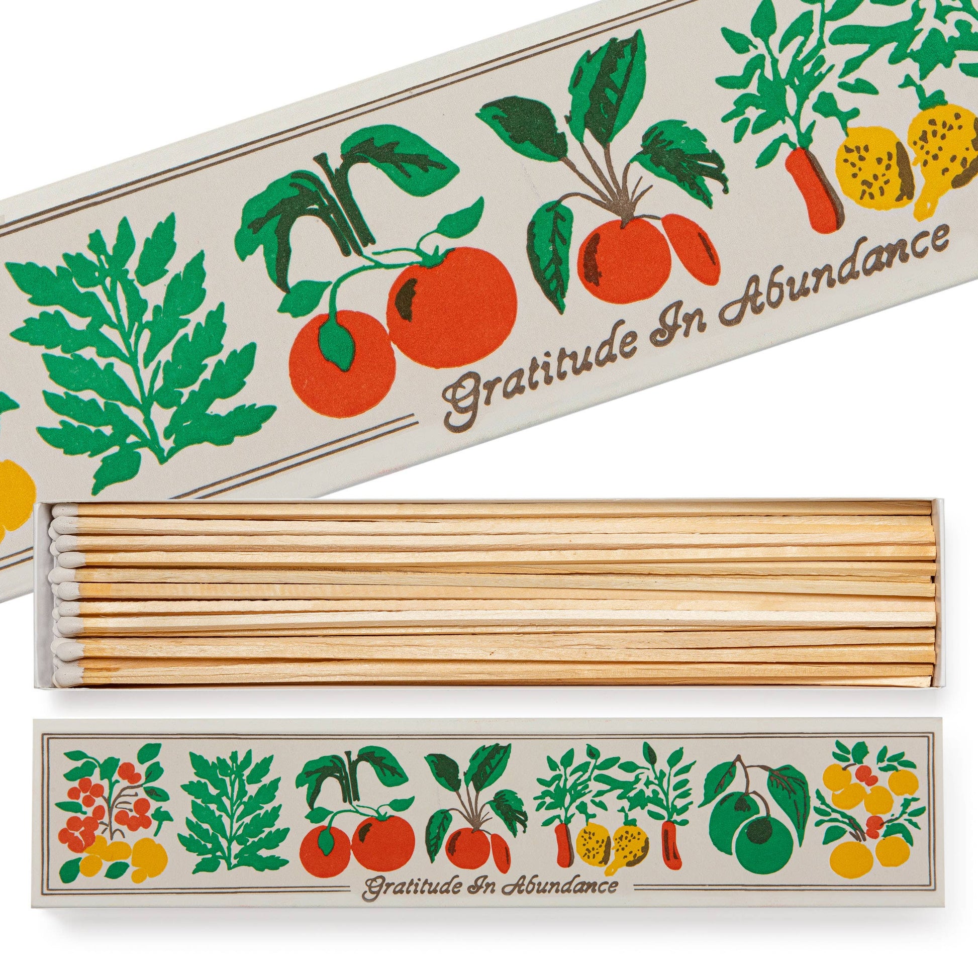 Die Archivist | 'Dankbarkeit im Überfluss' Lange Streichhölzer von Archivist | Europe kommen in einer rechteckigen Schachtel mit lebendiger Veggie-Kunst und sind mit langen, weiß gespitzten Streichhölzern gefüllt - perfekt, um jedem Raum Charme zu verleihen.
