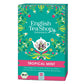 Eine lebendige Schachtel English Tea Shop | Tropical Mint, BIO (20 Teebeutel) von Royal Nature GmbH & Co. KG zeigt Blumen- und Blattmotive, eine weiße Teetasse und deutsche Produktinformationen auf einem türkis-rosa Hintergrund. Enthält Weißtee und erfrischende Pfefferminze.