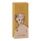 Eine rechteckige Schachtel mit der Handcreme Sheabutter" von Archivist Gallery, die eine minimalistische Strichzeichnung einer Frau mit Blumen im Haar auf einem senfgelben Hintergrund aus Kraftpapier zeigt.