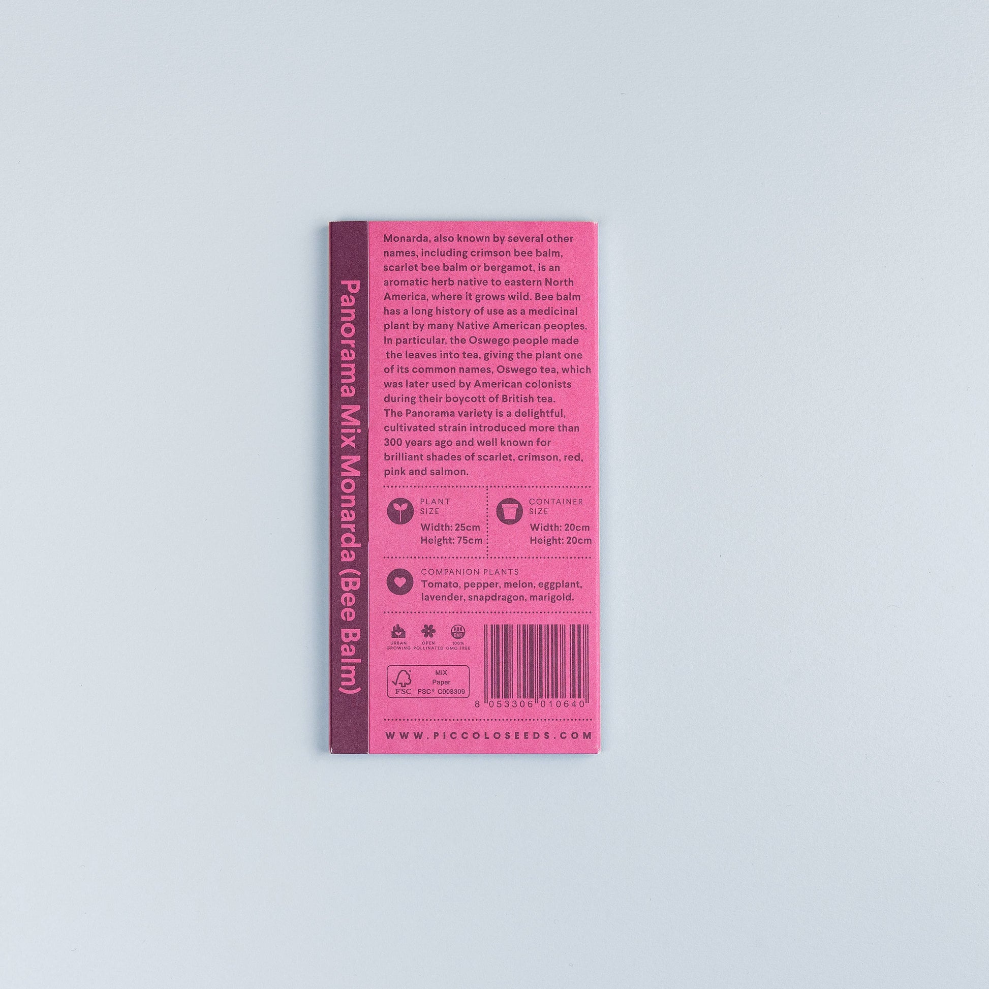 Eine rosafarbene Piccolo Seeds-Packung mit der Aufschrift 'Monarda Panorama-Mix' scharlachroter Bienenbalsam/Bergamotte mit Pflanzeninfos, Pflegetipps und Symbolen, dargestellt auf hellgrauem Hintergrund.