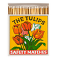 Die Archivist Gallery | 'Die Tulpen' Quadratische Streichhölzer zeigt eine lebhafte Tulpenillustration auf einer gelben Schachtel mit der Aufschrift THE TULIPS SAFETY MATCHES. Die geöffnete Schachtel enthüllt die Sicherheitsstreichhölzer im Inneren.