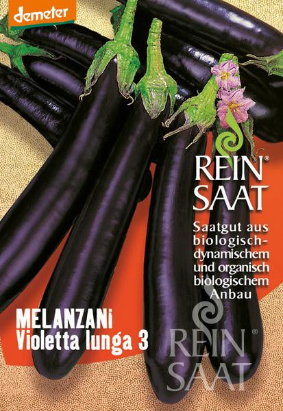 Mehrere lange, schlanke, dunkelviolette Melanzani mit grünen Stielen sind auf einem orangefarbenen Hintergrund abgebildet. Die Reinsaat-Verpackung mit der Aufschrift "Melanzani 'Violetta lunga 3'" enthält einen deutschen Text und ist ideal für den Gewächshausanbau.