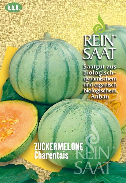 Die Abbildung auf der Saatgutpackung von Reinsaat | Zuckermelone 'Charentais' zeigt eine ganze und eine aufgeschnittene Melone mit leuchtend orangefarbenem Fruchtfleisch. Der deutsche Text weist auf den biologischen, biodynamischen Anbau von Reinsaat hin. Marke: Reinsaat.