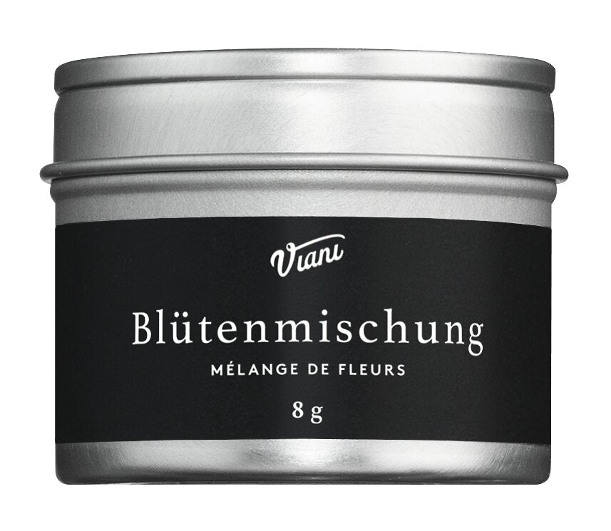 Eine silberne Dose mit schwarzem Etikett trägt die Marke Viani und den Namen 'Mélange de fleurs' Blütenmischung, die essbare Blüten für die kreative Küche hervorhebt, mit 8g darunter.