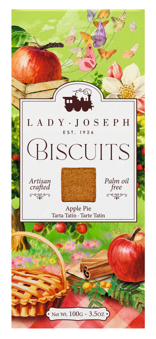 Entdecken Sie die „Apple Pie Biscuits“ von Lady Joseph – Apfel & Zimt – eine 100-g-Packung (3,5 oz) handgefertigter, palmölfreier, veganer Kekse. Die bezaubernde Verpackung zeigt Äpfel, einen Picknickkorb und eine malerische Landschaft. Genießen Sie den köstlichen Geschmack von Apfel und Zimt (Apfel-Zimt-Kekse) von Lady Joseph.