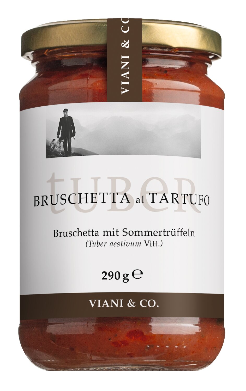 Ein Glas „Viani Bruschetta mit Sommertrüffeln“ (290 g) mit einem weißen Etikett, auf dem ein Schwarz-Weiß-Foto einer Person zu sehen ist, sowie einem Text, der das Produkt als „ein italienischer Aufstrich“ beschreibt.