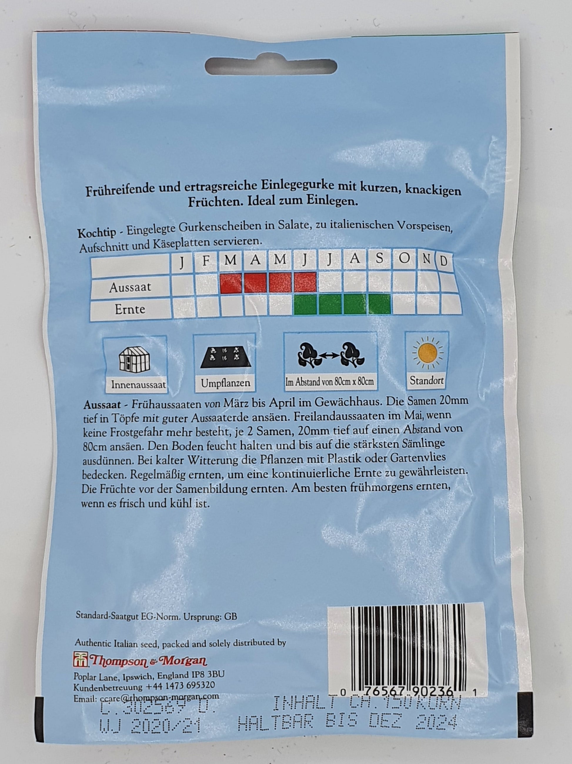 Rückseite der Samenpackung für Gurke Cetriolo Piccolo Di Parigi (Gewürzgurke) von Thompson und Morgan. Mit Pflanz- und Erntetabelle, deutscher Einlegeanleitung, Barcode und Pflegesymbolen auf blauem Hintergrund. Mindesthaltbarkeitsdatum: Dezember 2024.